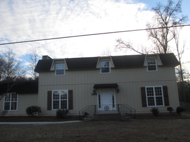 6940 Columbus Road Lizella, GA 31052 - Photo 14 of 14 a view of a house with a street