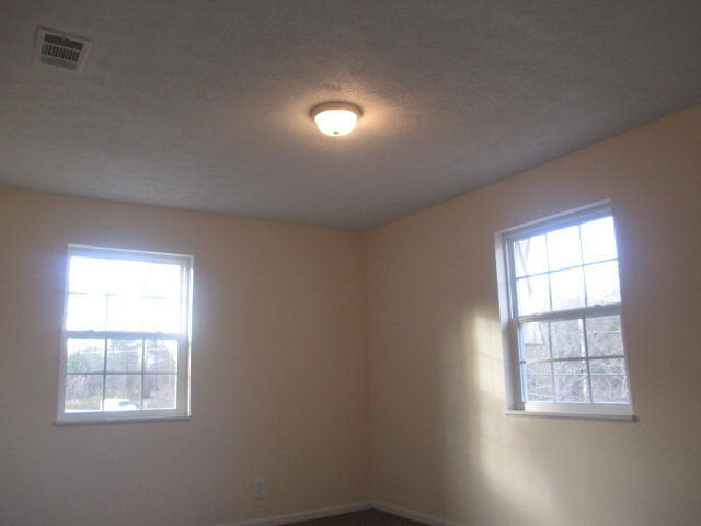 6940 Columbus Road Lizella, GA 31052 - Photo 8 of 14 an empty room with a window
