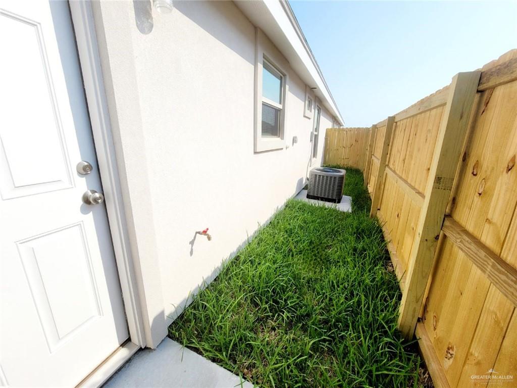 3808 Las Vistas Lane, Unit 1 Weslaco, TX 78596 - Photo 20 of 20 a view of a back yard from a corridor
