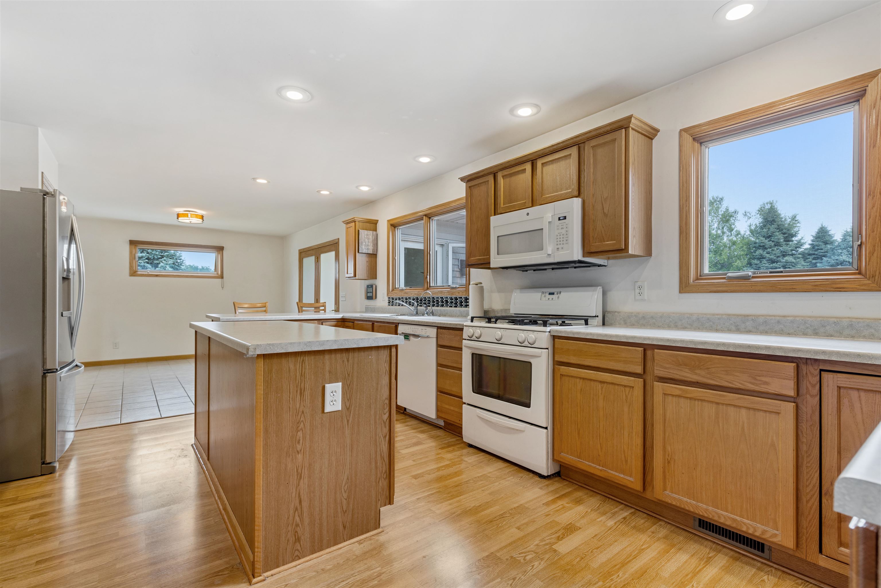 8609 South Rood Road Kingston, IL 60145 - Photo 8 of 39 a kitchen with stainless steel appliances granite countertop a stove a sink and a refrigerator