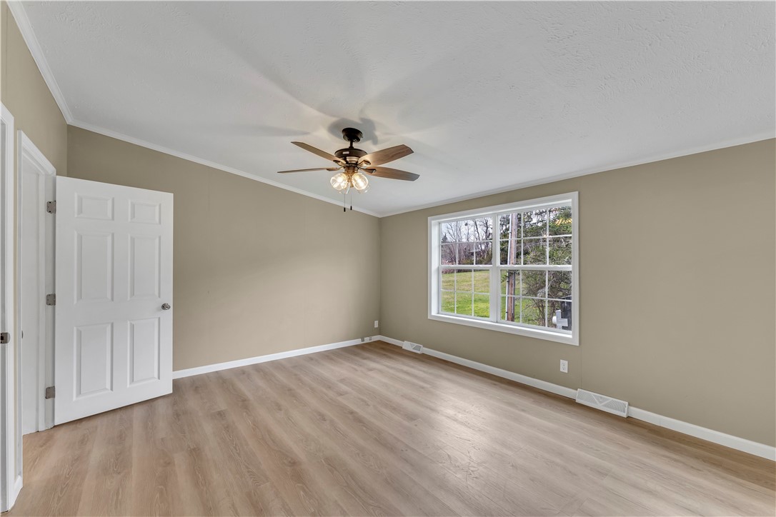 12082 State Highway Walton, NY 13856 - Photo 14 of 28 Primary Bedroom with ceiling fan and laminate flooring