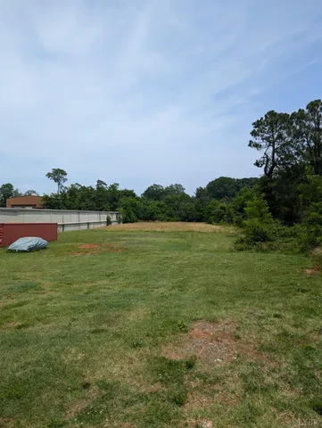 a view of a lake with houses in the back