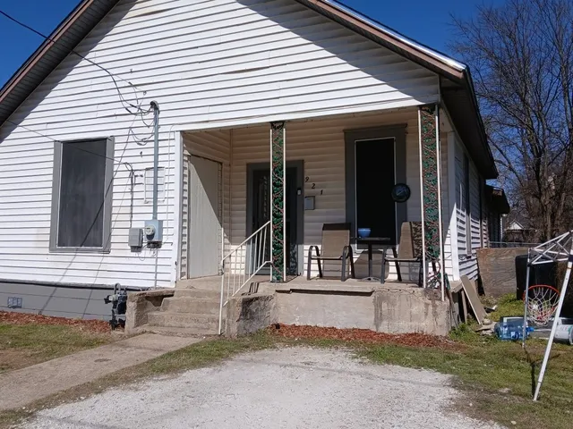 a view of house with outdoor space and porch