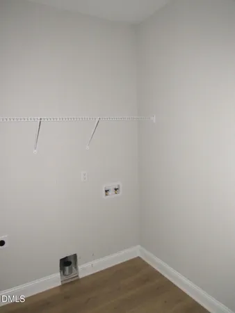 a view of a small space with wooden floor