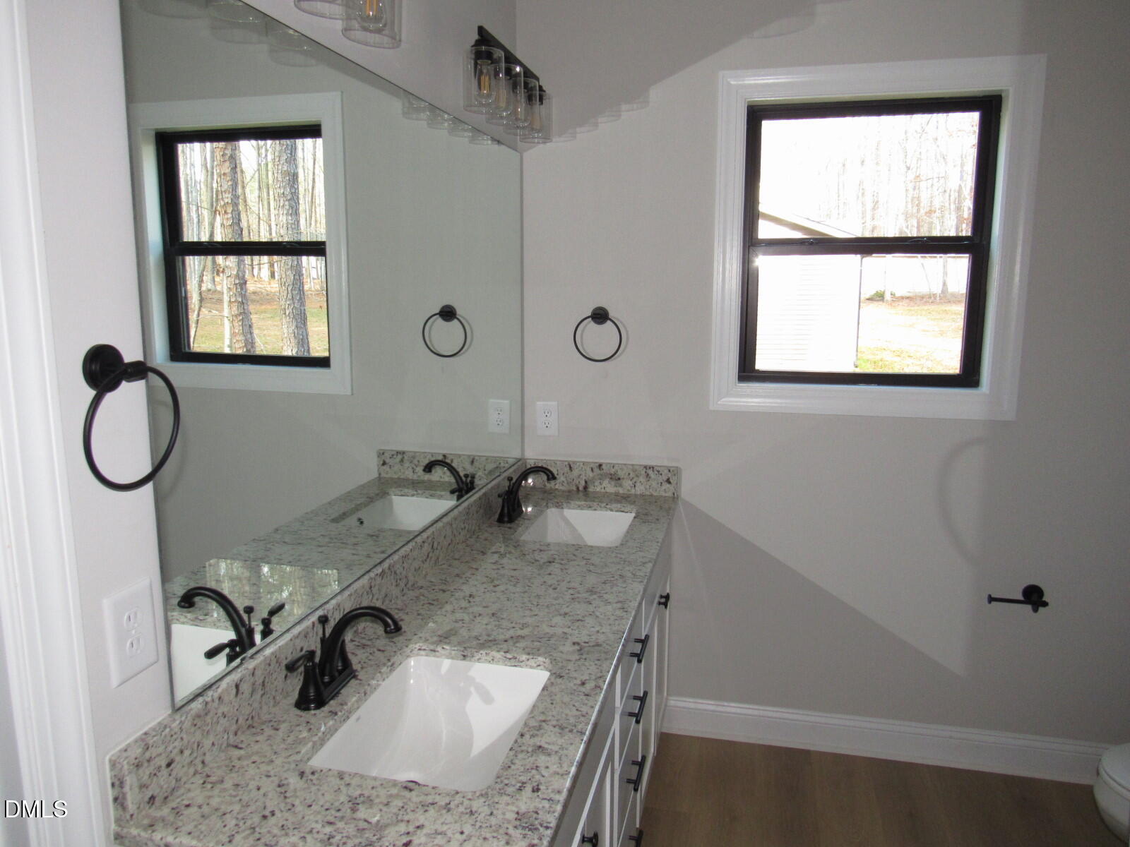 116 Beaver Trail Littleton, NC 27850 - Photo 17 of 47 a bathroom with a granite countertop sink and a window