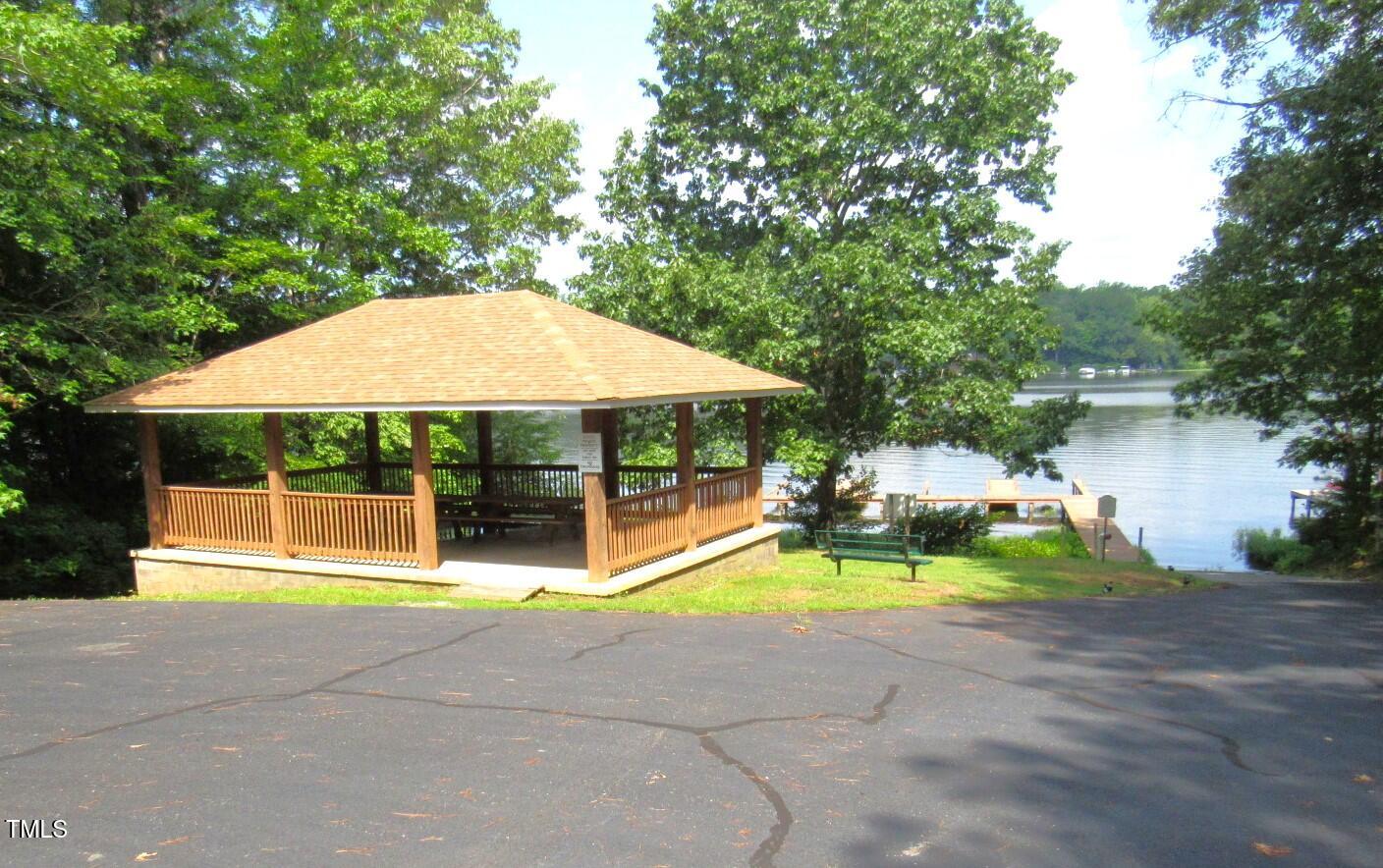 116 Beaver Trail Littleton, NC 27850 - Photo 40 of 47 a view of swimming pool with lawn chairs under an umbrella
