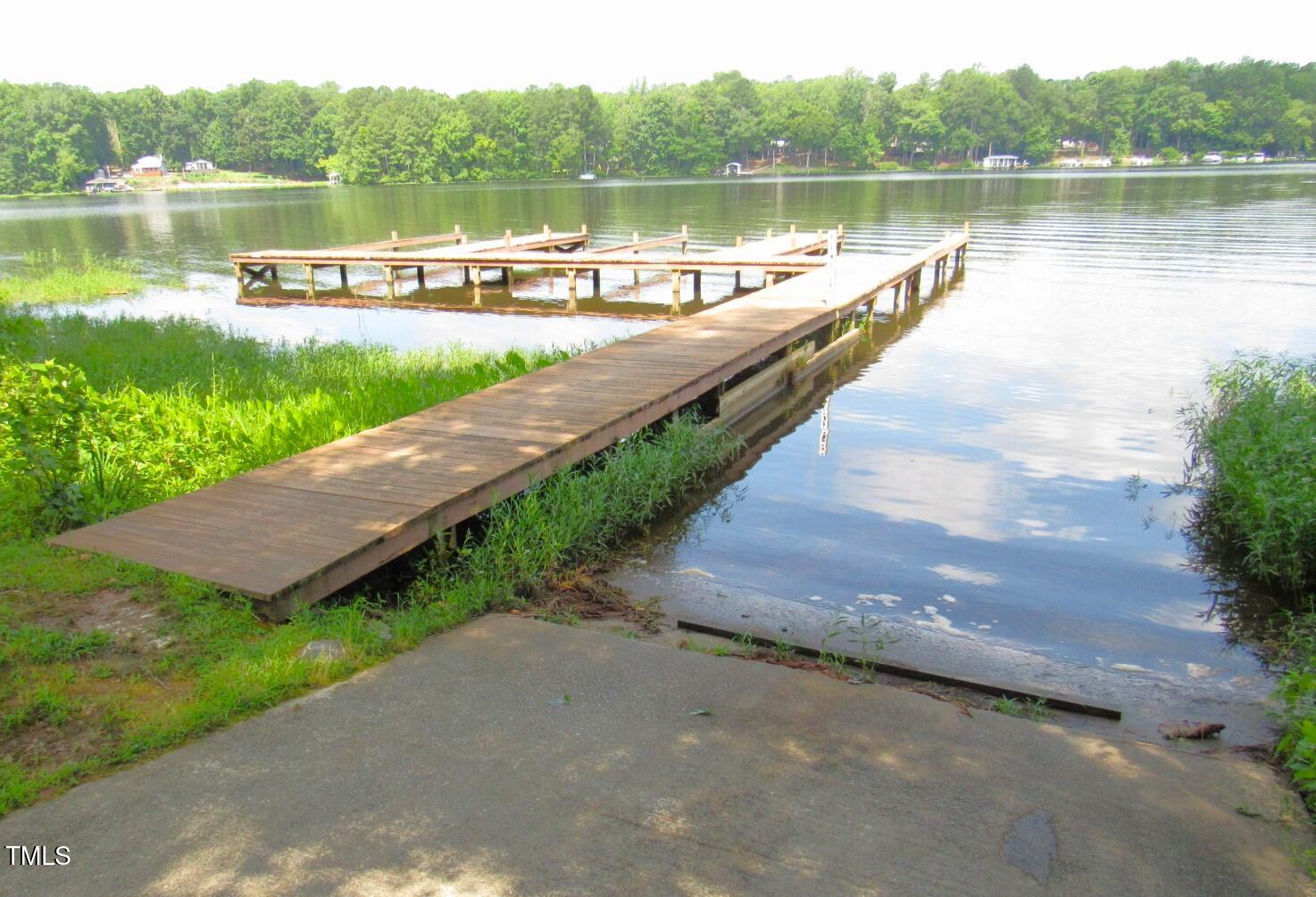 116 Beaver Trail Littleton, NC 27850 - Photo 42 of 47 a view of a lake with a city from a lake