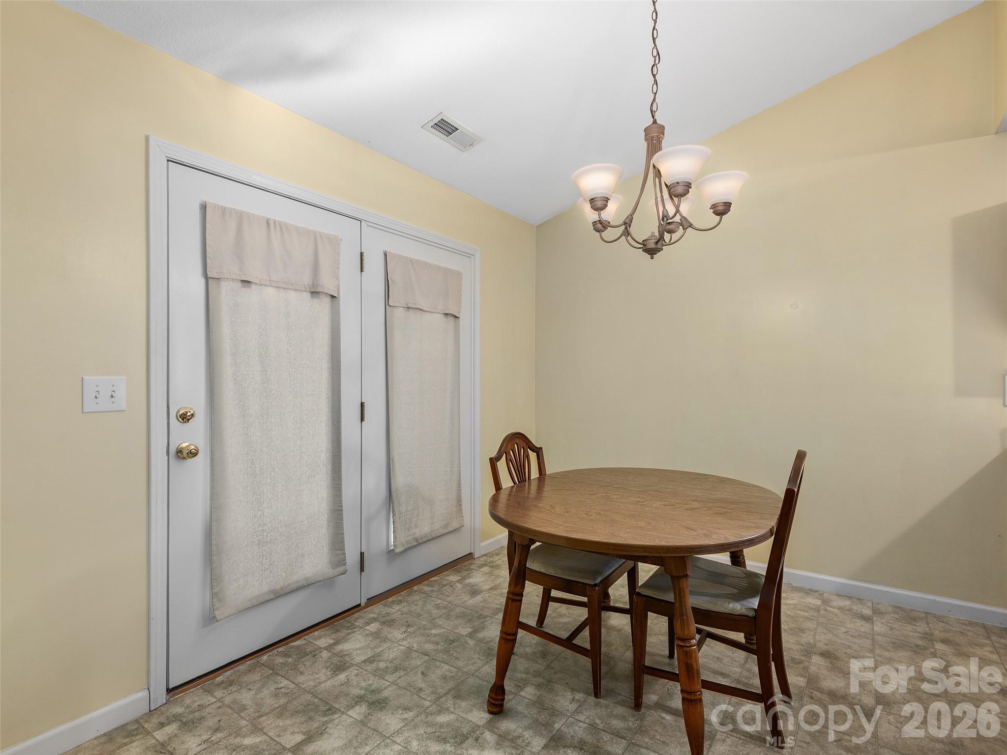 88 Wiltshire Circle Fletcher, NC 28732 - Photo 5 of 16 a view of a dining room with a table and chairs