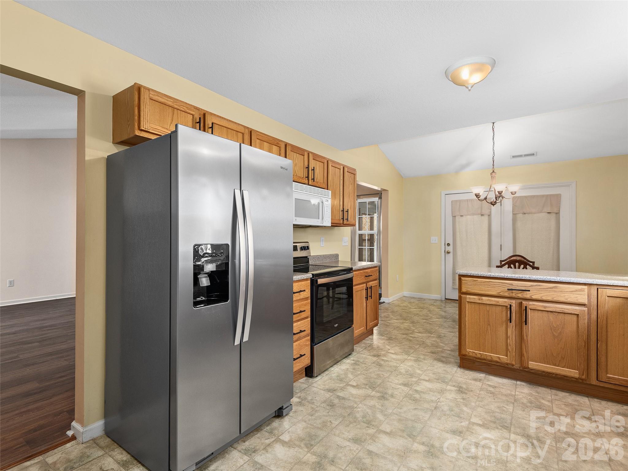 88 Wiltshire Circle Fletcher, NC 28732 - Photo 9 of 16 a kitchen with stainless steel appliances granite countertop a refrigerator and a sink