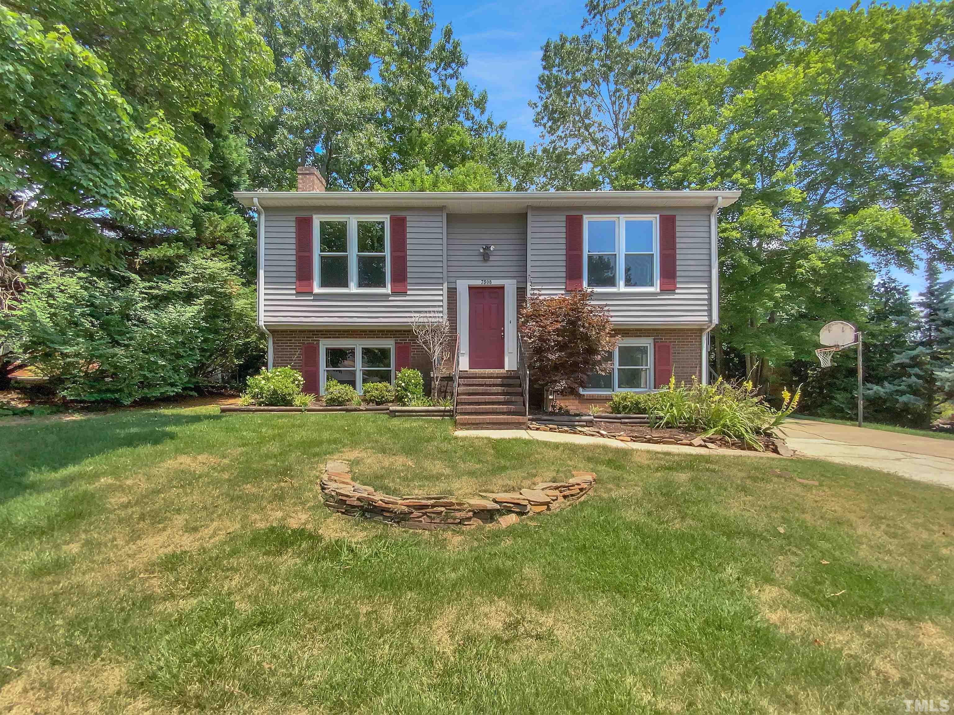 7508 Mine Shaft Road Raleigh, NC 27615 - Photo 1 of 18 a front view of house with yard and green space