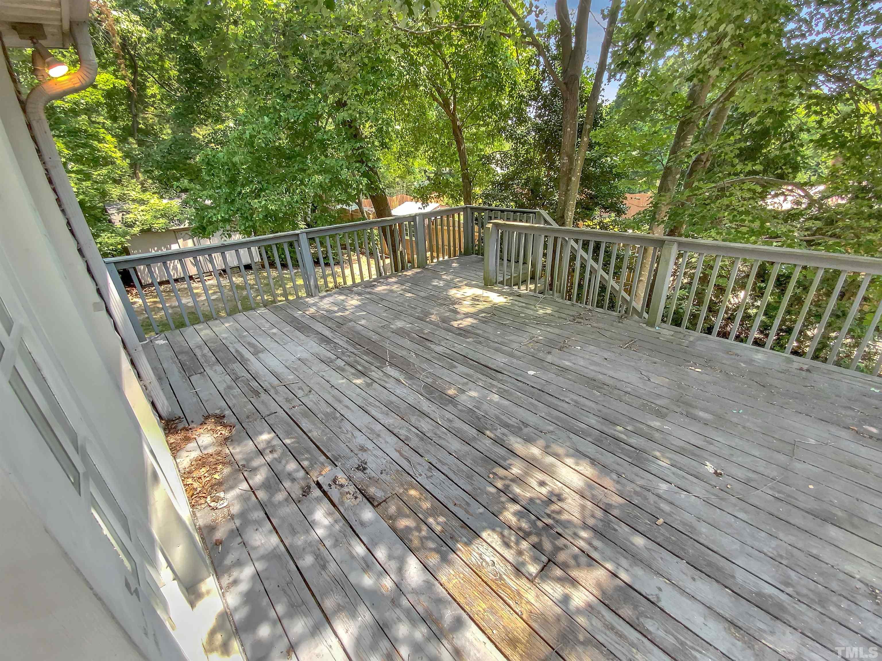 7508 Mine Shaft Road Raleigh, NC 27615 - Photo 17 of 18 a view of balcony with wooden floor