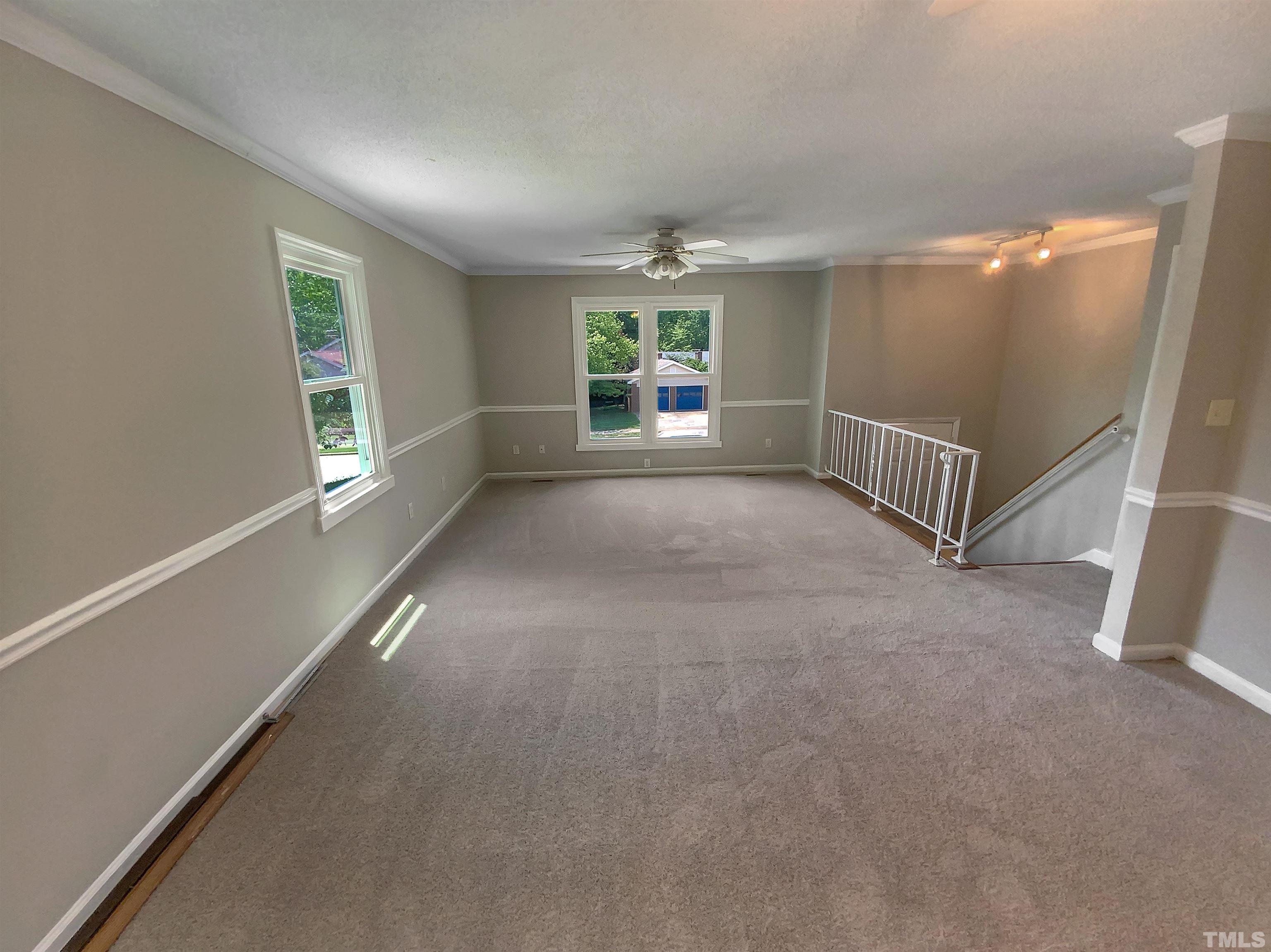 7508 Mine Shaft Road Raleigh, NC 27615 - Photo 3 of 18 a view of livingroom with hardwood floor and window