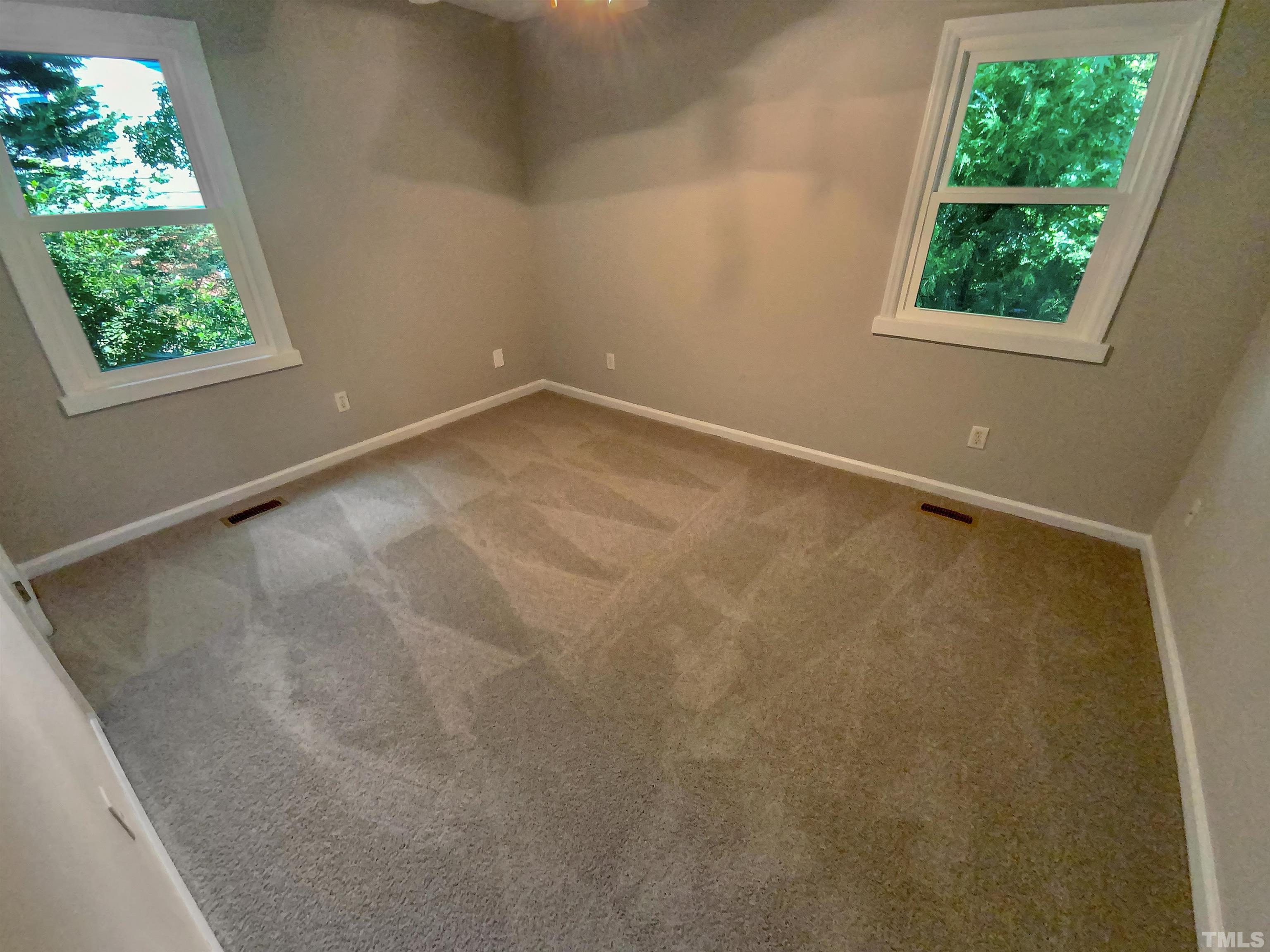 7508 Mine Shaft Road Raleigh, NC 27615 - Photo 6 of 18 an empty room with windows