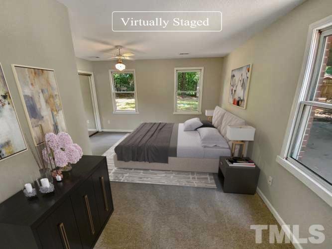 7508 Mine Shaft Road Raleigh, NC 27615 - Photo 8 of 18 a bedroom with a bed and wooden floor