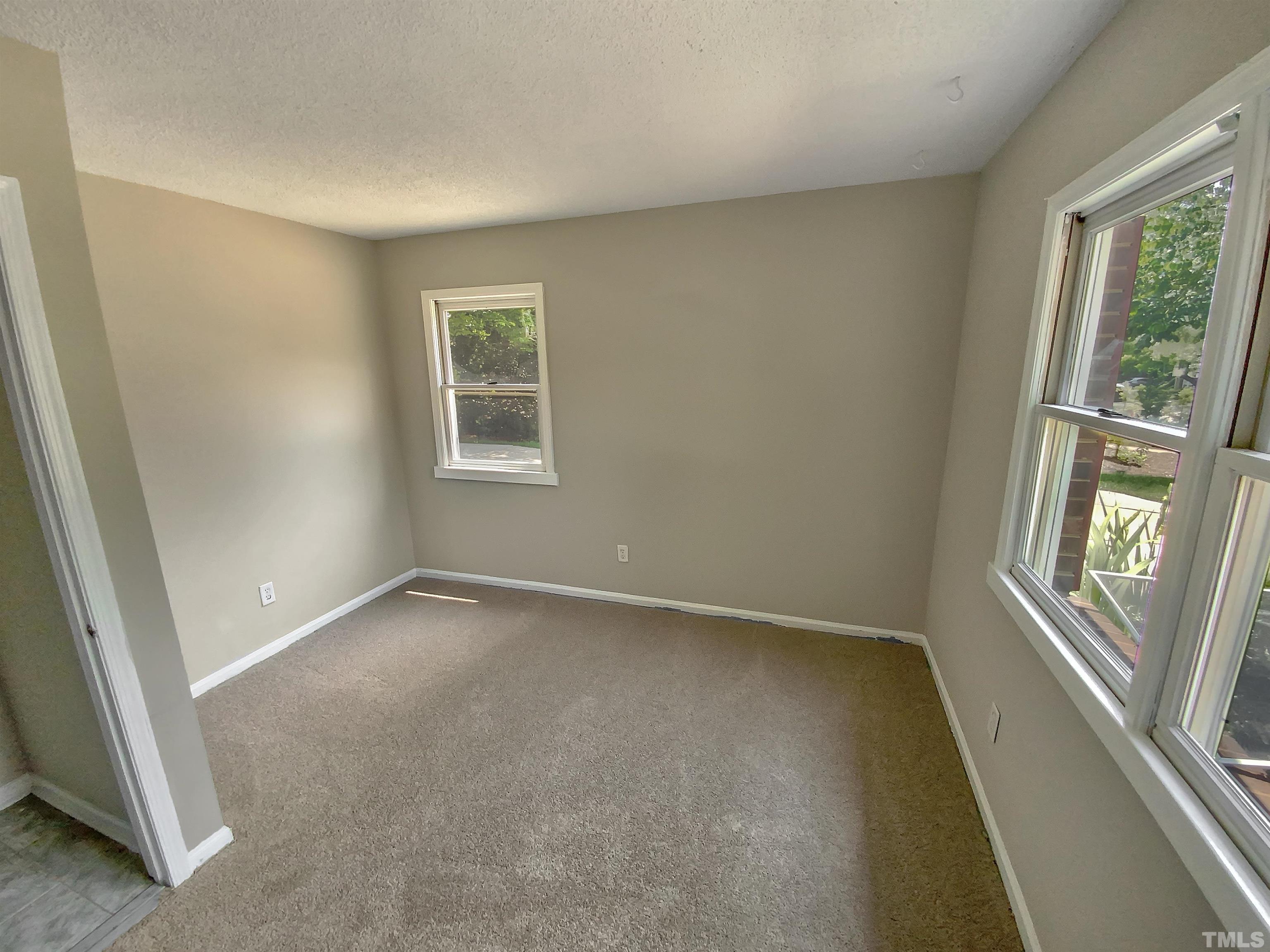 7508 Mine Shaft Road Raleigh, NC 27615 - Photo 10 of 18 an empty room with a window