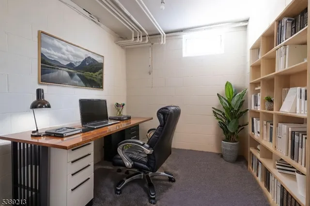 a view of a workspace with furniture