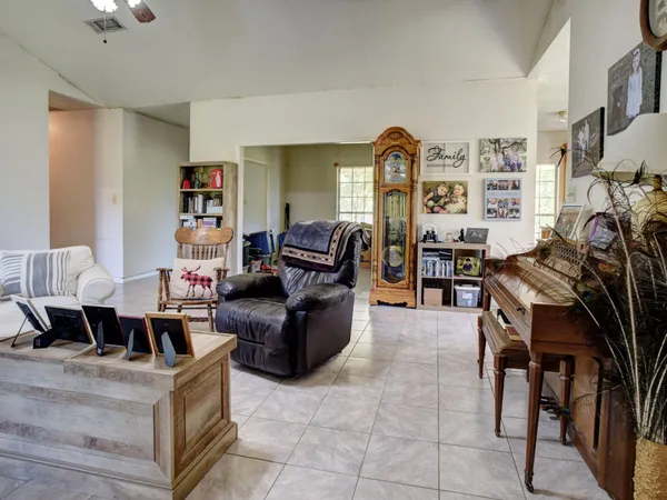 a view of a dining room with furniture window and outside view