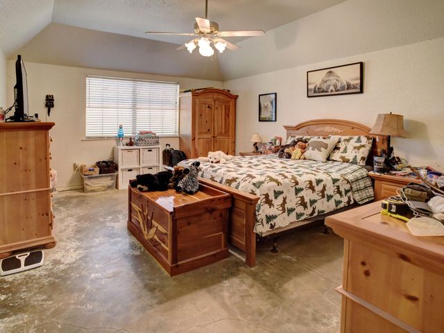 a bed room with a bed and a television