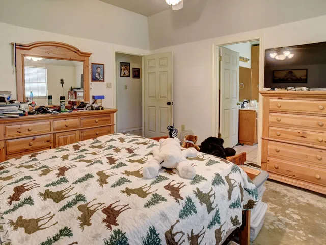 a bathroom with a tub and a window