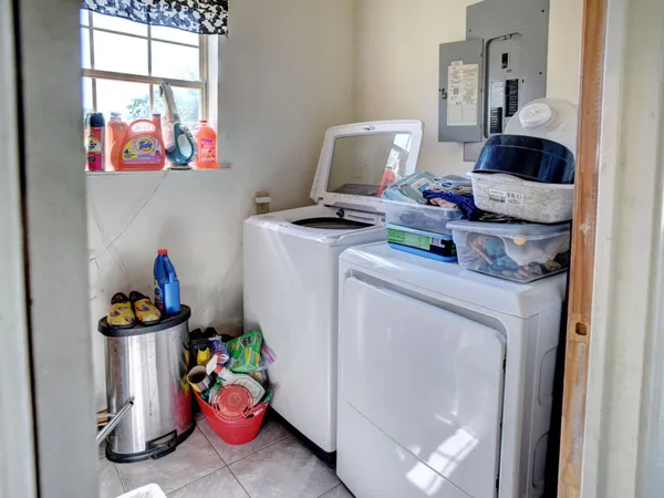 a backyard of a house with yard and outdoor seating