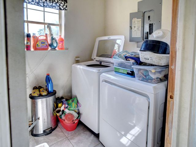 a backyard of a house with yard and outdoor seating