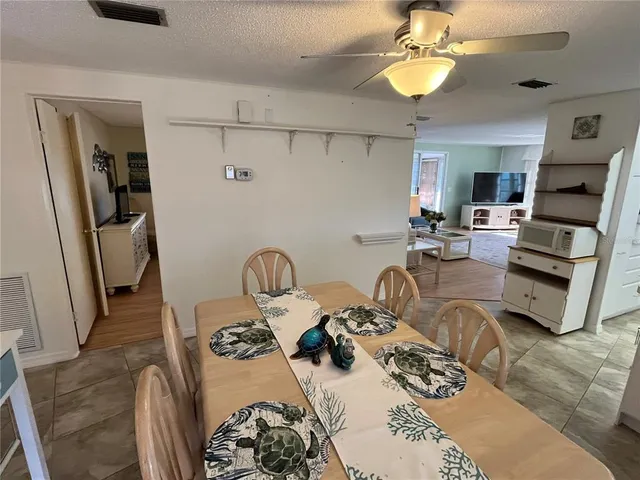 a view of a livingroom with furniture and a chandelier