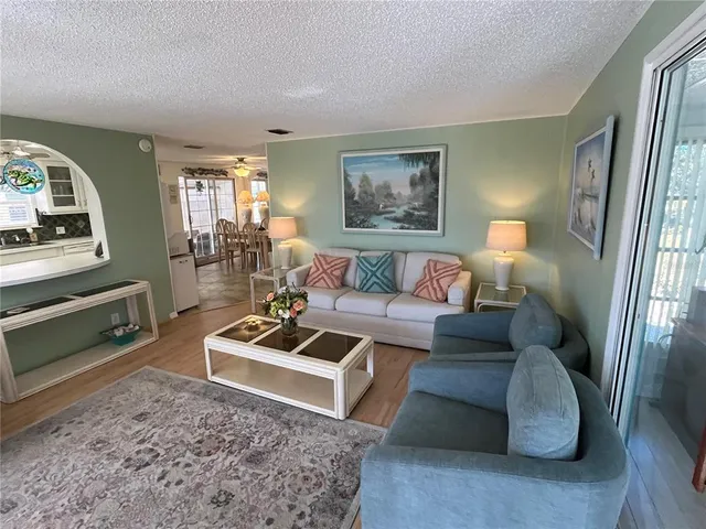 a living room with furniture and a rug
