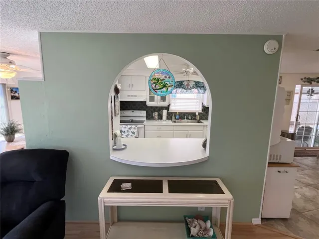 a room with a sink and a mirror