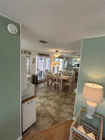 a living room with furniture a rug and a view of living room