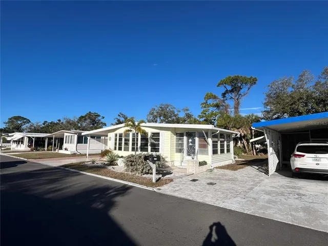 a view of a house with a car park