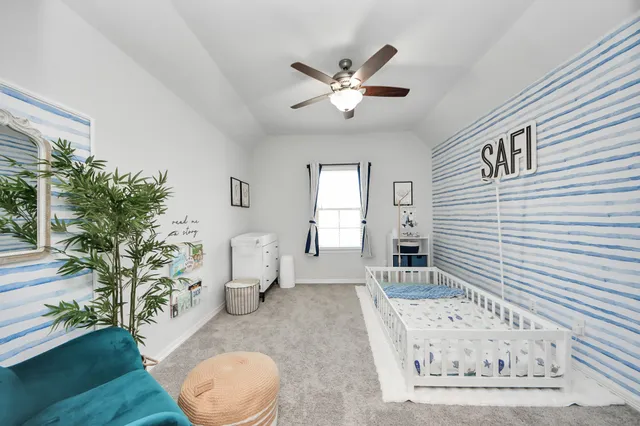 a view of a hallway with entryway and a potted plant
