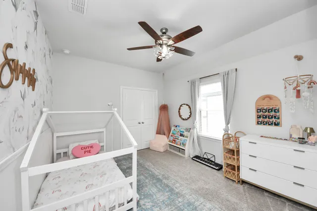 a view of a livingroom with furniture and workspace