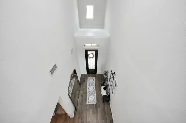 a view of balcony with wooden floor