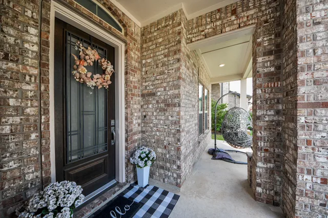 a front view of a house with a porch