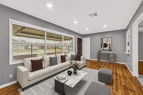 a living room with furniture and a large window