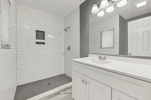 a bathroom with a sink a vanity and a mirror