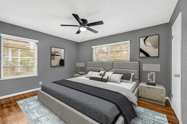 a bedroom with a large bed and a window