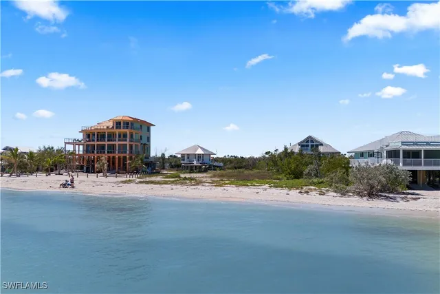 a view of a lake with outdoor seating