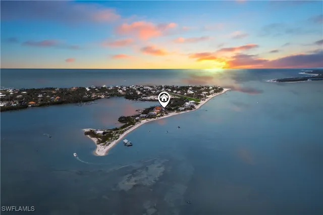 an aerial view of a house with a swimming pool
