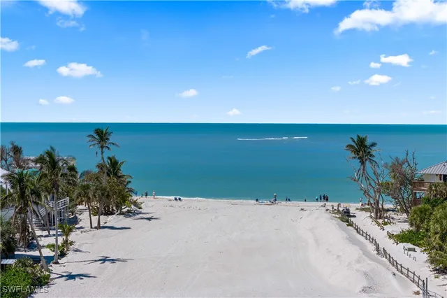 a view of multiple houses with a big yard