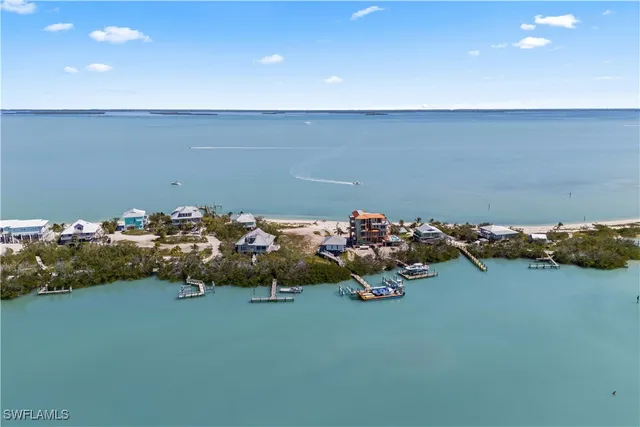 an aerial view of a house with a table and chairs