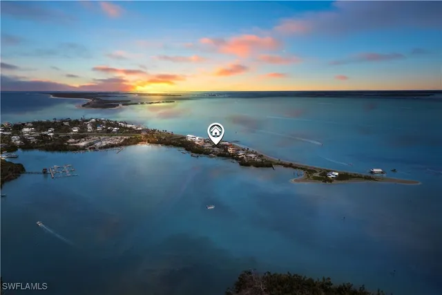 an aerial view of a ocean beach and mountain view