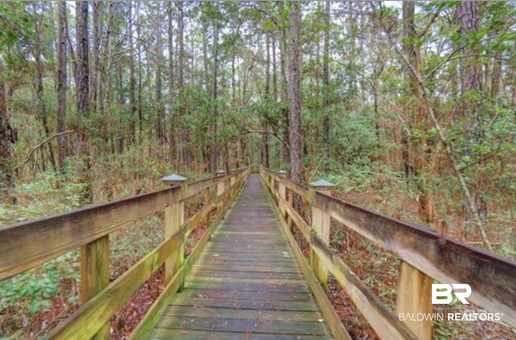 430 West Fort Morgan Road Gulf Shores, AL 36542 - Photo 5 of 27 Wood boardwalk pathway with timber railings