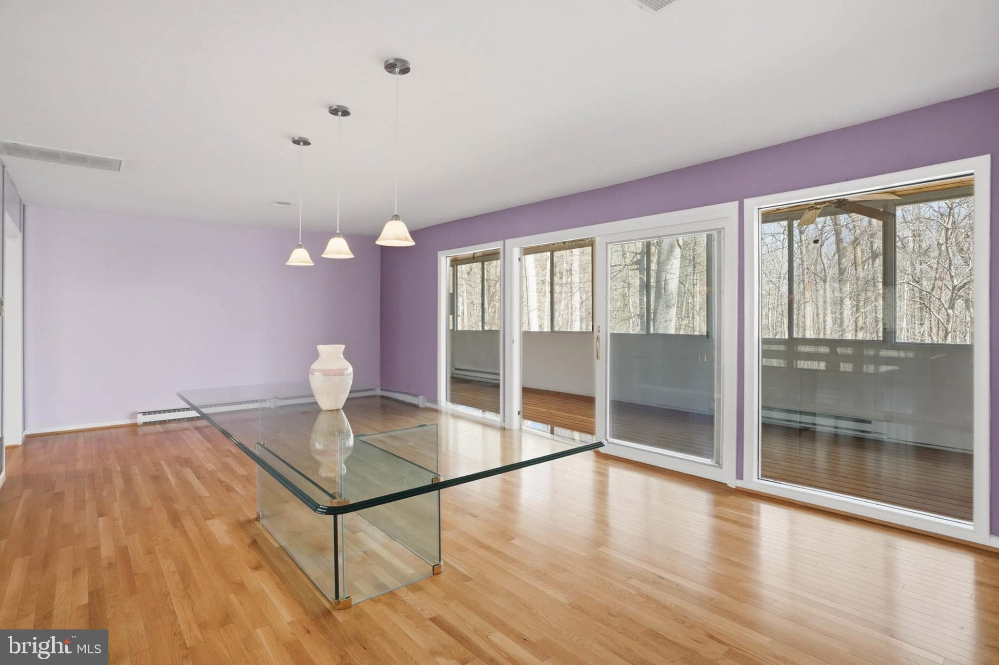 14917 Claude Lane Silver Spring, MD 20905 - Photo 16 of 52 a view of a livingroom with wooden floor and a flat screen tv
