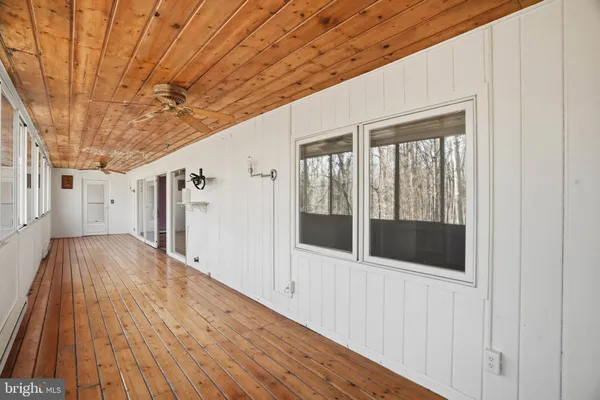 a view of a room with rack and wooden floor