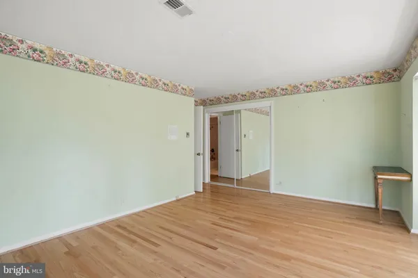 a view of a porch with a floor to ceiling window