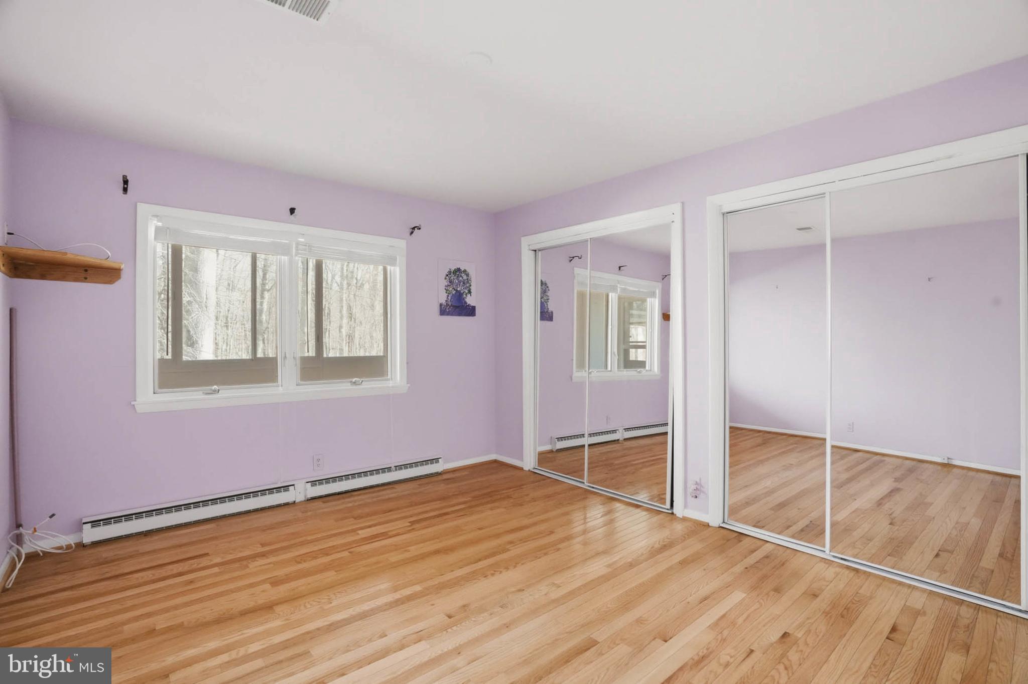 14917 Claude Lane Silver Spring, MD 20905 - Photo 26 of 52 a view of empty room with wooden floor and fan