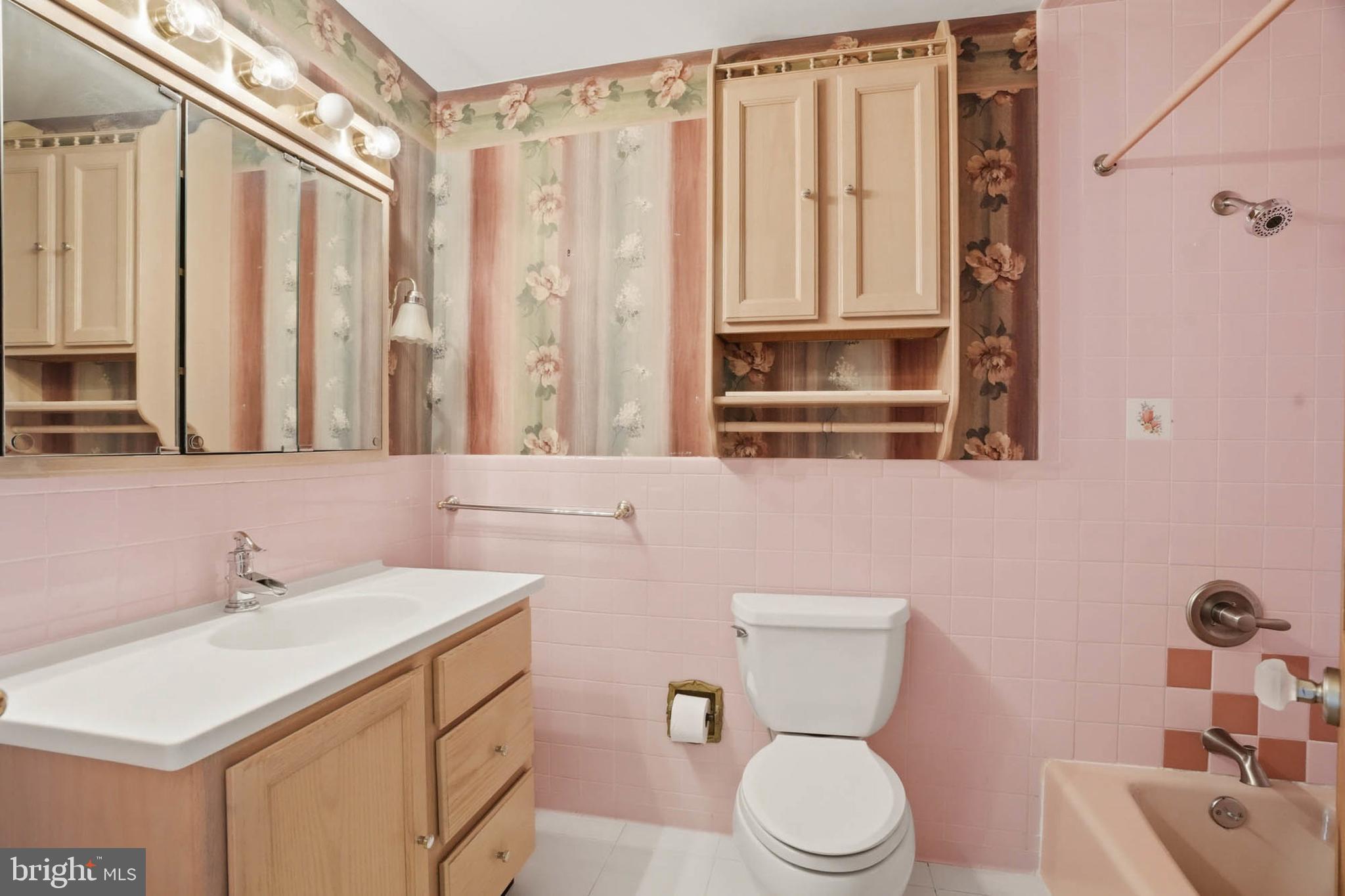 14917 Claude Lane Silver Spring, MD 20905 - Photo 30 of 52 a bathroom with a toilet sink and mirror