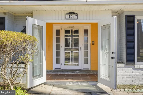 a view of a livingroom with wooden floor and a flat screen tv