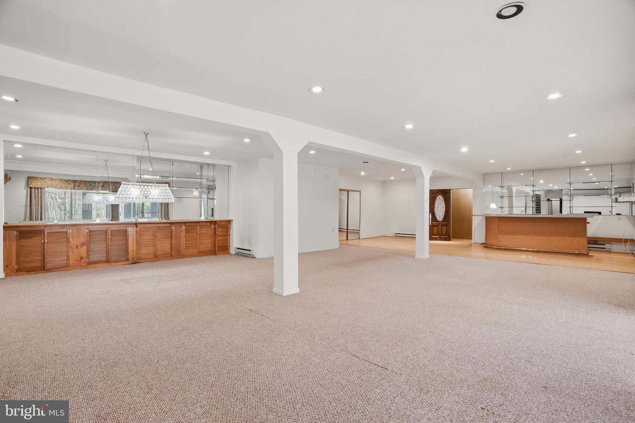 14917 Claude Lane Silver Spring, MD 20905 - Photo 32 of 52 a view of an empty room with a kitchen